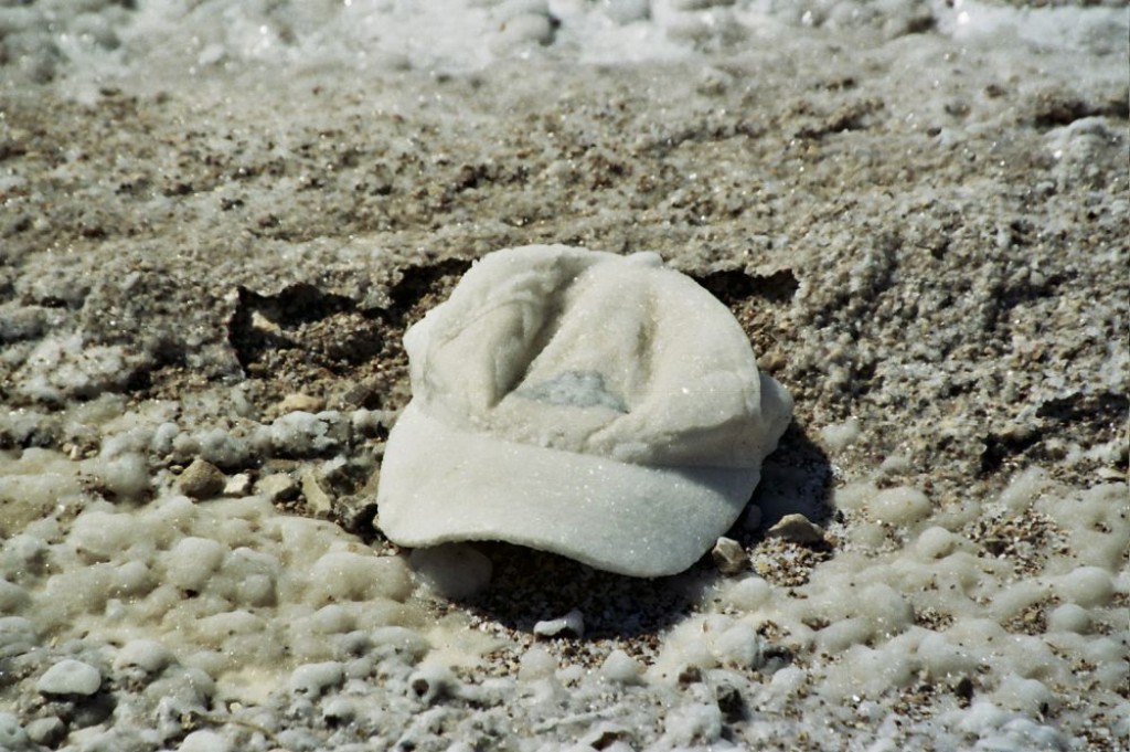 Someone lost a hat in the Dead Sea, and it washed up on shore, encrusted in salt.
